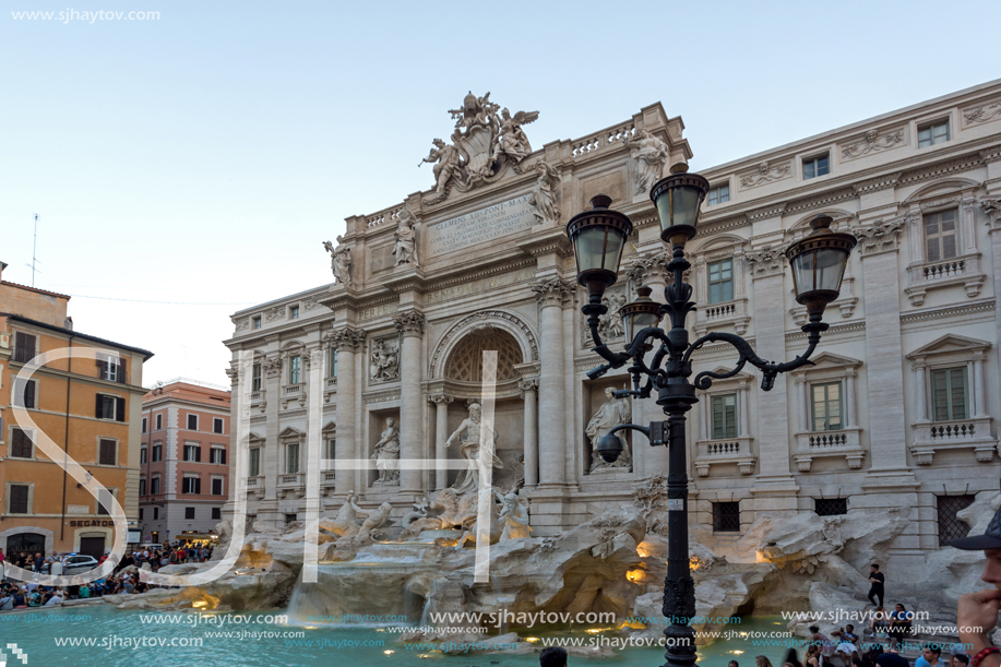 ROME, ITALY - JUNE 24, 2017: Sunset view of People visiting Trevi Fountain (Fontana di Trevi) in city of Rome, Italy