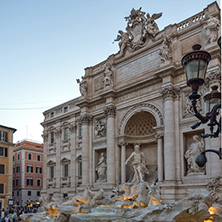 ROME, ITALY - JUNE 24, 2017: Sunset view of People visiting Trevi Fountain (Fontana di Trevi) in city of Rome, Italy