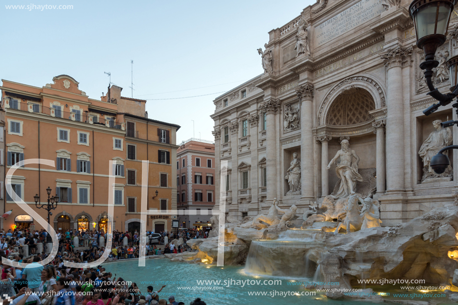 ROME, ITALY - JUNE 24, 2017: Sunset view of People visiting Trevi Fountain (Fontana di Trevi) in city of Rome, Italy