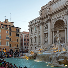 ROME, ITALY - JUNE 24, 2017: Sunset view of People visiting Trevi Fountain (Fontana di Trevi) in city of Rome, Italy
