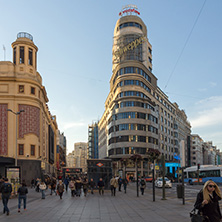 MADRID, SPAIN - JANUARY 22, 2018: Sunset view of walking people at Callao Square (Plaza del Callao) in City of Madrid, Spain