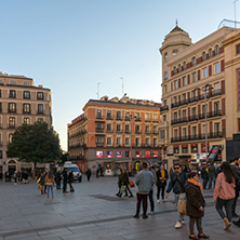 MADRID, SPAIN - JANUARY 22, 2018: Sunset view of walking people at Callao Square (Plaza del Callao) in City of Madrid, Spain