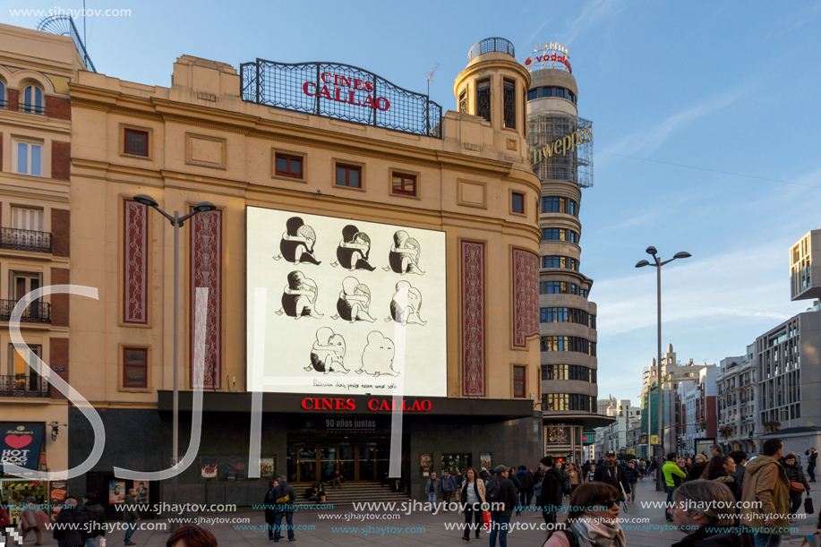 MADRID, SPAIN - JANUARY 22, 2018: Sunset view of walking people at Callao Square (Plaza del Callao) in City of Madrid, Spain