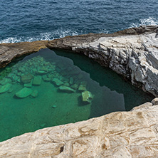 Green waters of Giola Natural Pool in Thassos island, East Macedonia and Thrace, Greece