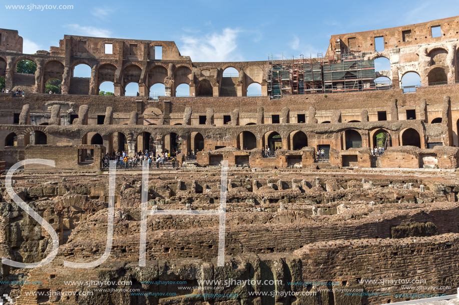 ROME, ITALY - JUNE 24, 2017: Tourists visiting inside part of  Colosseum in city of Rome, Italy