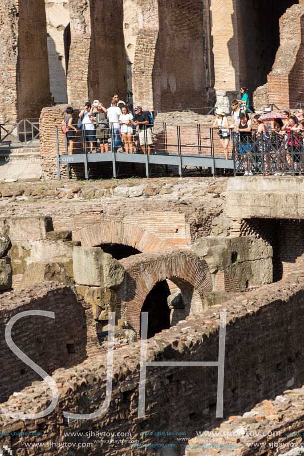 ROME, ITALY - JUNE 24, 2017: Tourists visiting inside part of  Colosseum in city of Rome, Italy
