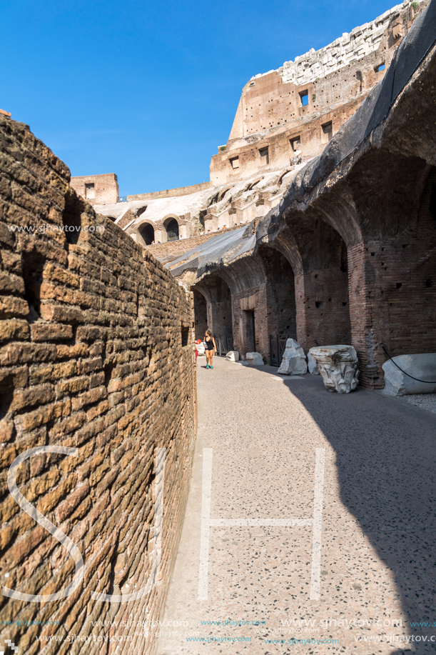 ROME, ITALY - JUNE 24, 2017: Tourists visiting inside part of  Colosseum in city of Rome, Italy