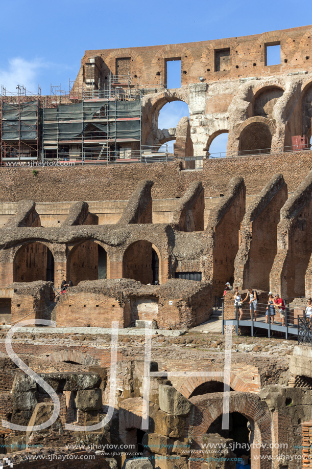 ROME, ITALY - JUNE 24, 2017: Tourists visiting inside part of  Colosseum in city of Rome, Italy