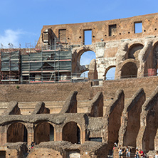 ROME, ITALY - JUNE 24, 2017: Tourists visiting inside part of  Colosseum in city of Rome, Italy