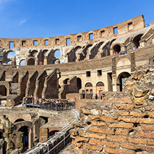 ROME, ITALY - JUNE 24, 2017: Tourists visiting inside part of  Colosseum in city of Rome, Italy