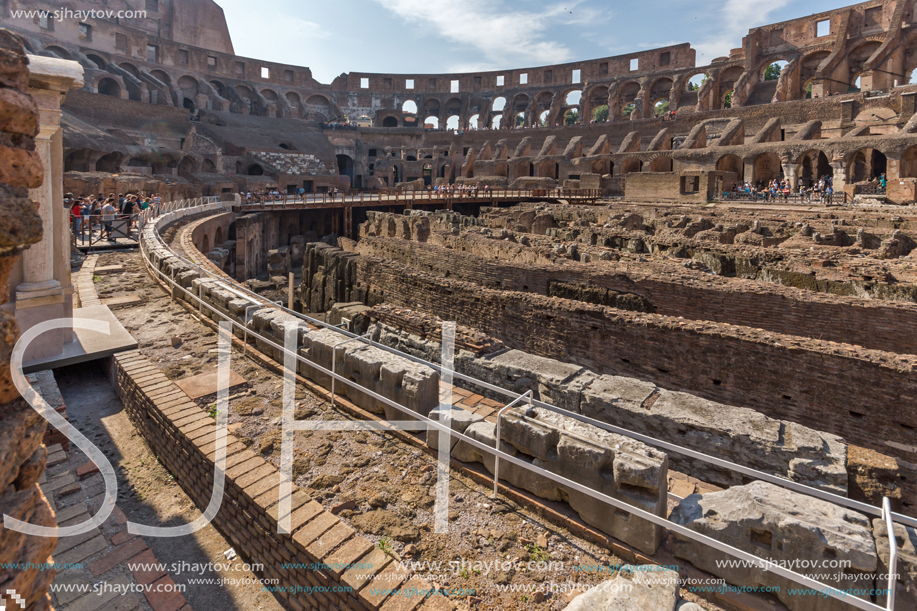 ROME, ITALY - JUNE 24, 2017: Tourists visiting inside part of  Colosseum in city of Rome, Italy