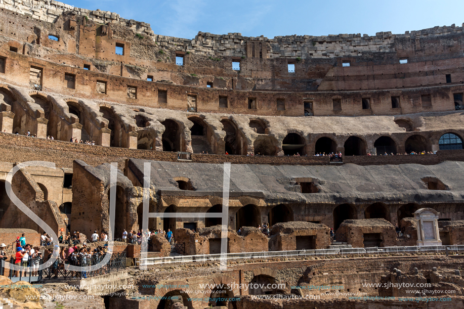 ROME, ITALY - JUNE 24, 2017: Tourists visiting inside part of  Colosseum in city of Rome, Italy