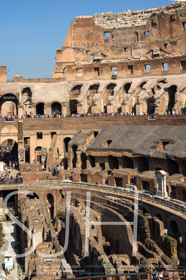 ROME, ITALY - JUNE 24, 2017: Tourists visiting inside part of  Colosseum in city of Rome, Italy