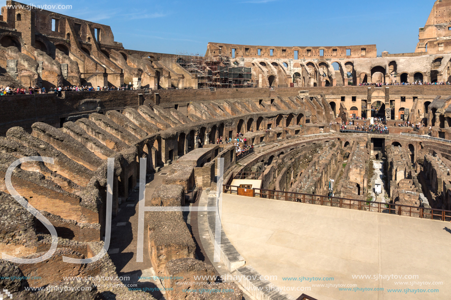 ROME, ITALY - JUNE 24, 2017: Tourists visiting inside part of  Colosseum in city of Rome, Italy