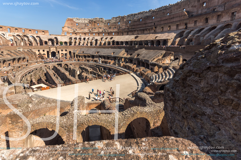 ROME, ITALY - JUNE 24, 2017: Tourists visiting inside part of  Colosseum in city of Rome, Italy
