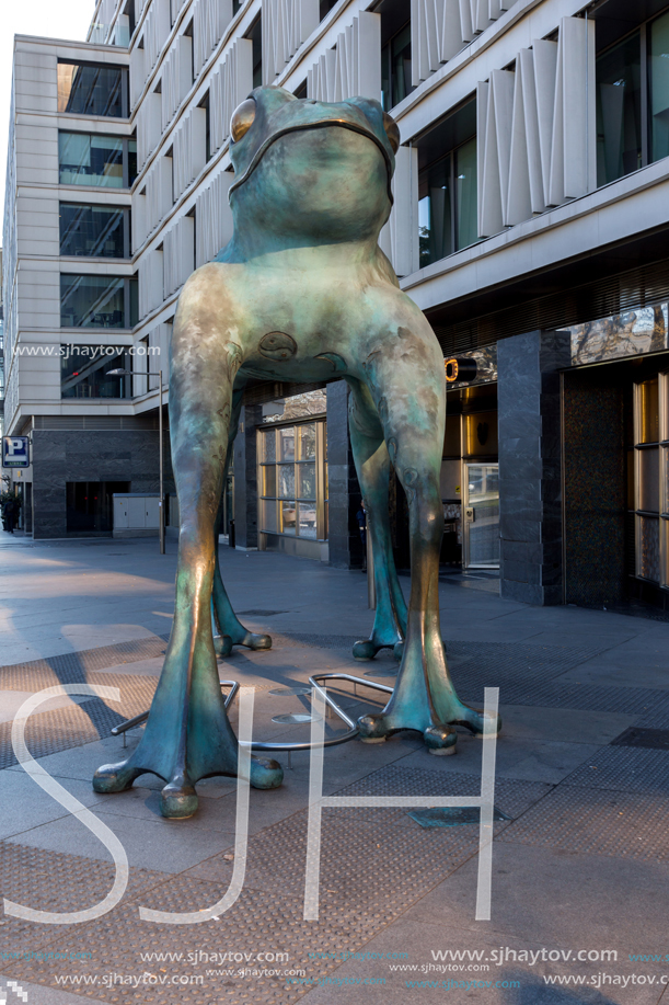 MADRID, SPAIN - JANUARY 21, 2018: Statue of a frog and Cera Museum at Paseo de la Castellana street in City of Madrid, Spain