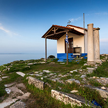 Amazing sunset of Orthodox church at coastline of Thassos town, East Macedonia and Thrace, Greece