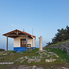 Amazing sunset of Orthodox church at coastline of Thassos town, East Macedonia and Thrace, Greece