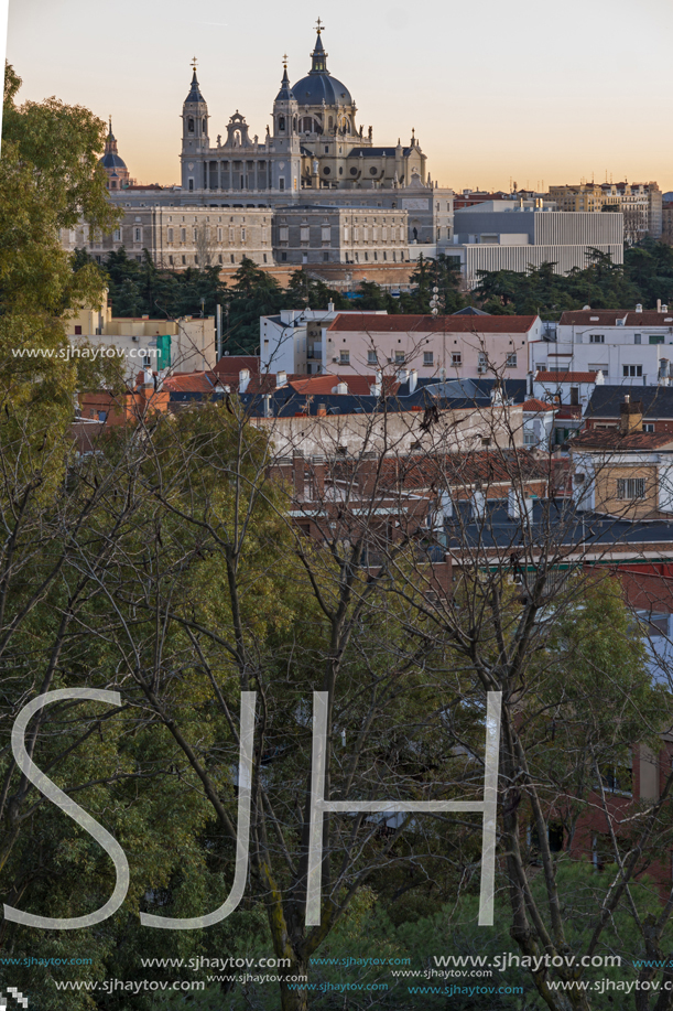 MADRID, SPAIN - JANUARY 21, 2018:  Sunset view of Royal Palace and Almudena Cathedral in City of Madrid, Spain