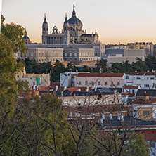MADRID, SPAIN - JANUARY 21, 2018:  Sunset view of Royal Palace and Almudena Cathedral in City of Madrid, Spain