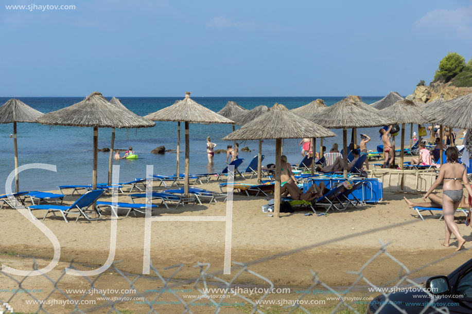 CHALKIDIKI, CENTRAL MACEDONIA, GREECE - AUGUST 25, 2014: Seascape of Blue Dolphin Cove Beach at Sithonia peninsula, Chalkidiki, Central Macedonia, Greece