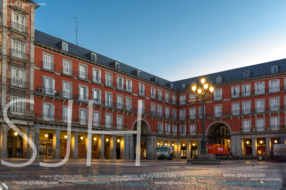 MADRID, SPAIN - JANUARY 22, 2018:  Sunrise view of Plaza Mayor with statue of King Philips III in Madrid, Spain