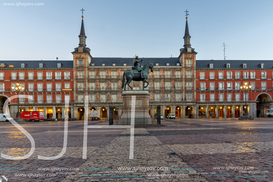 MADRID, SPAIN - JANUARY 22, 2018:  Sunrise view of Plaza Mayor with statue of King Philips III in Madrid, Spain