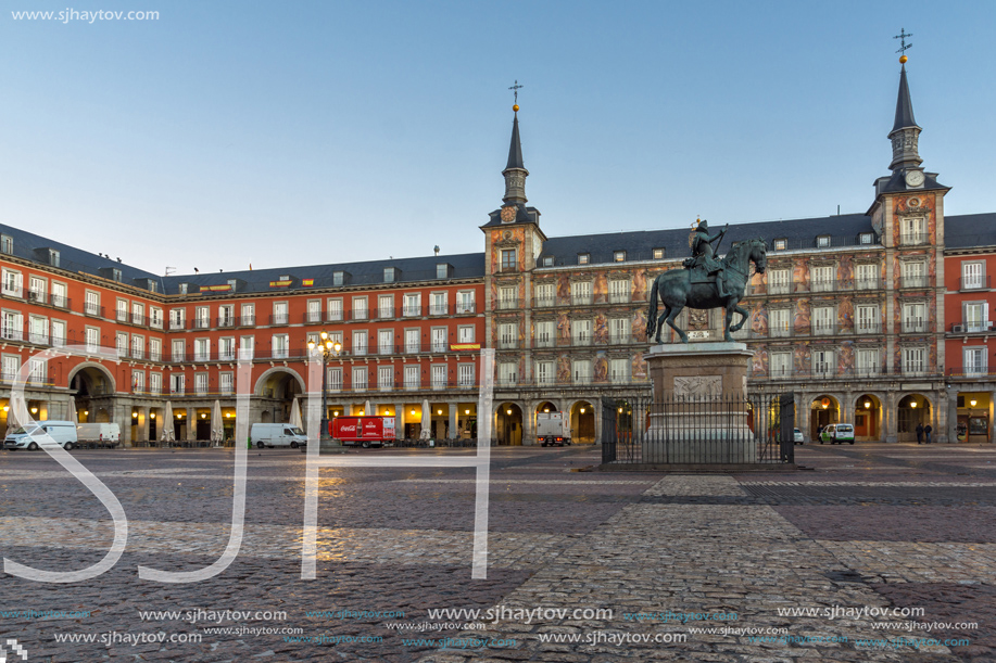 MADRID, SPAIN - JANUARY 22, 2018:  Sunrise view of Plaza Mayor with statue of King Philips III in Madrid, Spain