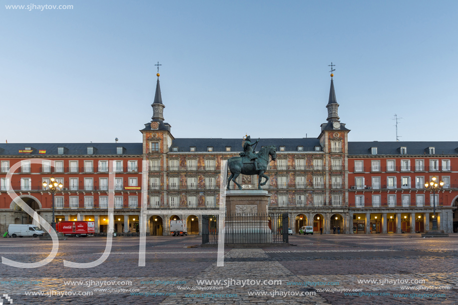 MADRID, SPAIN - JANUARY 22, 2018:  Sunrise view of Plaza Mayor with statue of King Philips III in Madrid, Spain