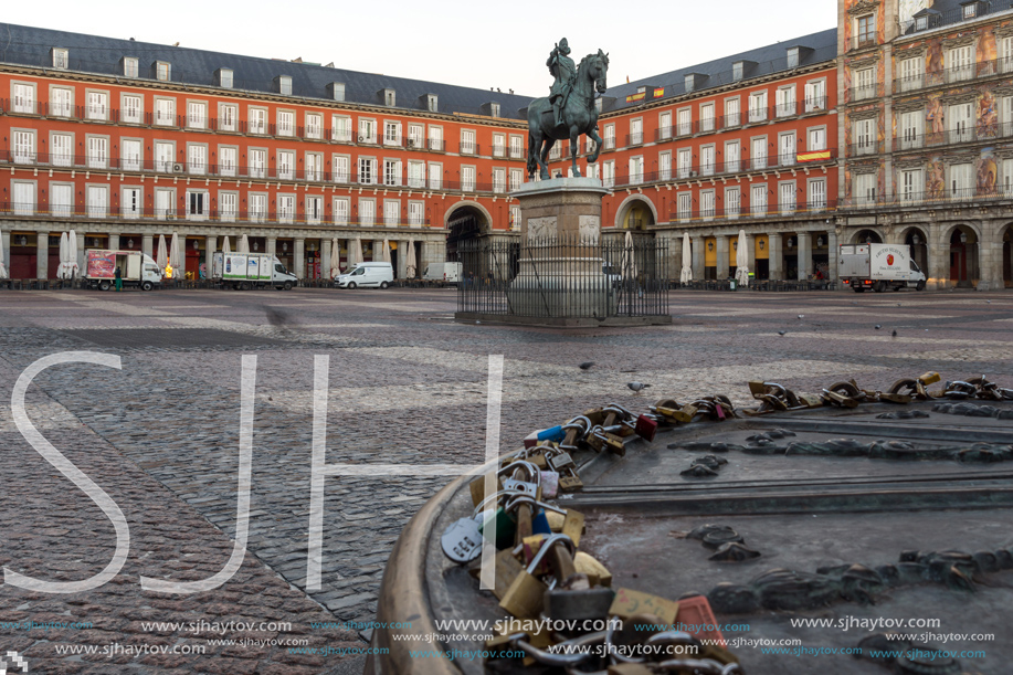 MADRID, SPAIN - JANUARY 22, 2018:  Sunrise view of Plaza Mayor with statue of King Philips III in Madrid, Spain