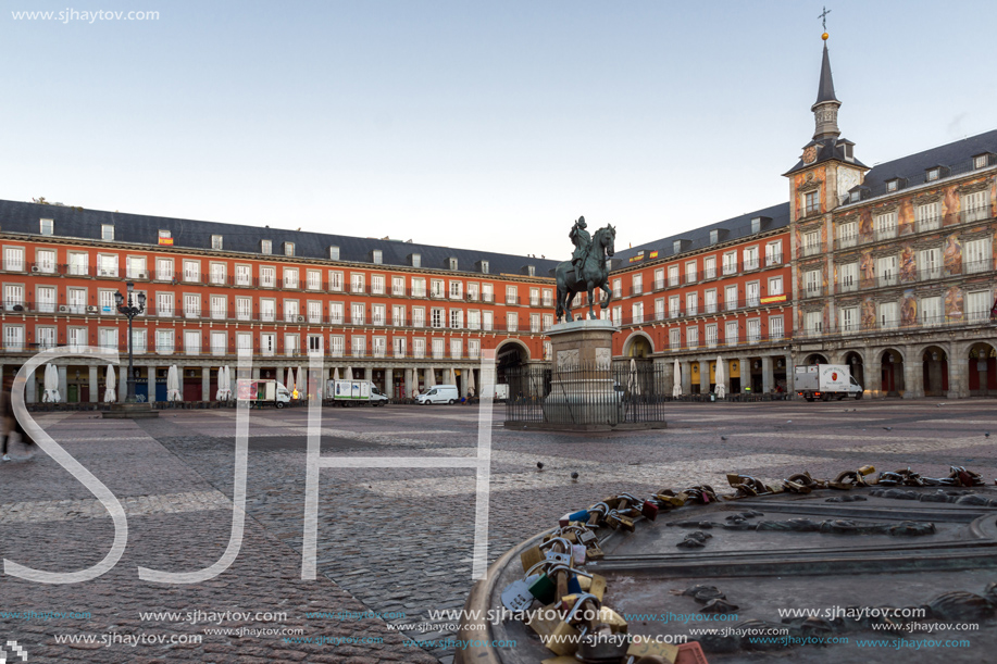 MADRID, SPAIN - JANUARY 22, 2018:  Sunrise view of Plaza Mayor with statue of King Philips III in Madrid, Spain