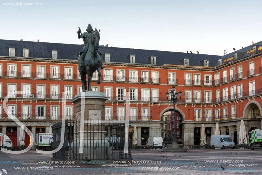 MADRID, SPAIN - JANUARY 22, 2018:  Sunrise view of Plaza Mayor with statue of King Philips III in Madrid, Spain