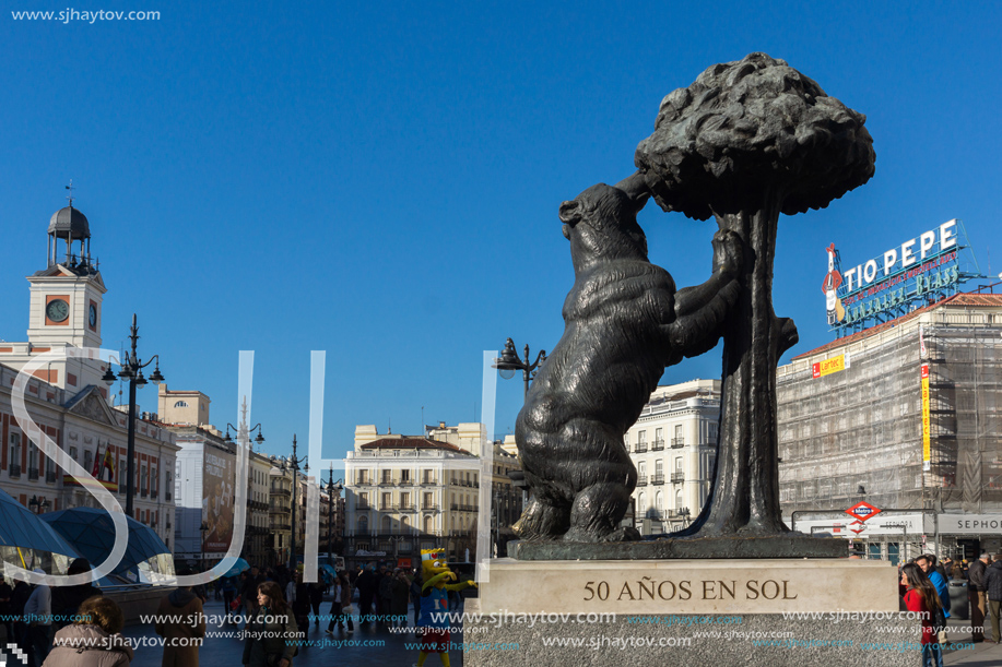 MADRID, SPAIN - JANUARY 22, 2018:  Statue of the Bear and the Strawberry Tree at Puerta del Sol in Madrid, Spain