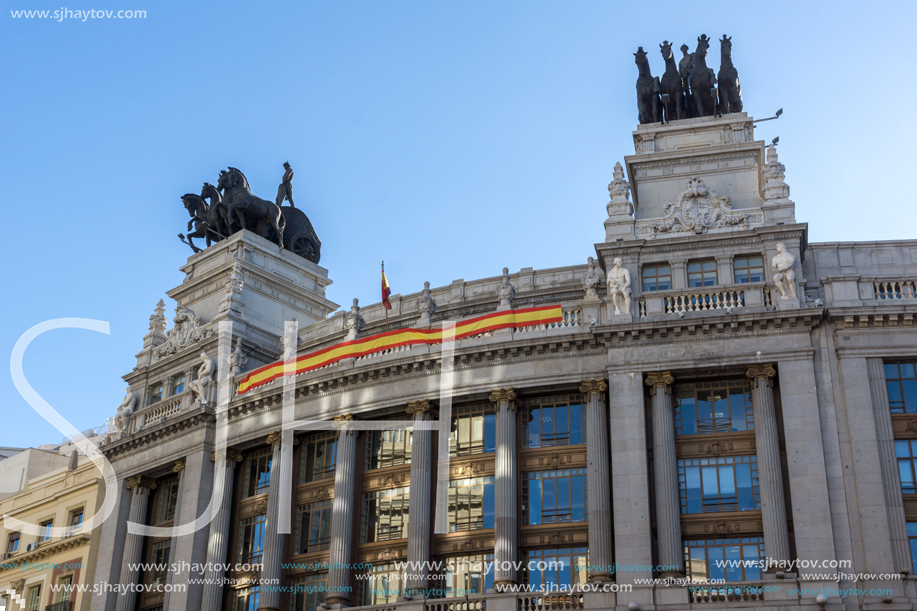 MADRID, SPAIN - JANUARY 22, 2018: Building with Sculpture of a chariot at Alcala street in city of Madrid, Spain