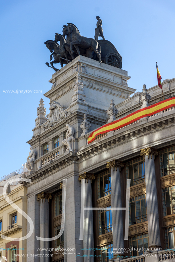 MADRID, SPAIN - JANUARY 22, 2018: Building with Sculpture of a chariot at Alcala street in city of Madrid, Spain