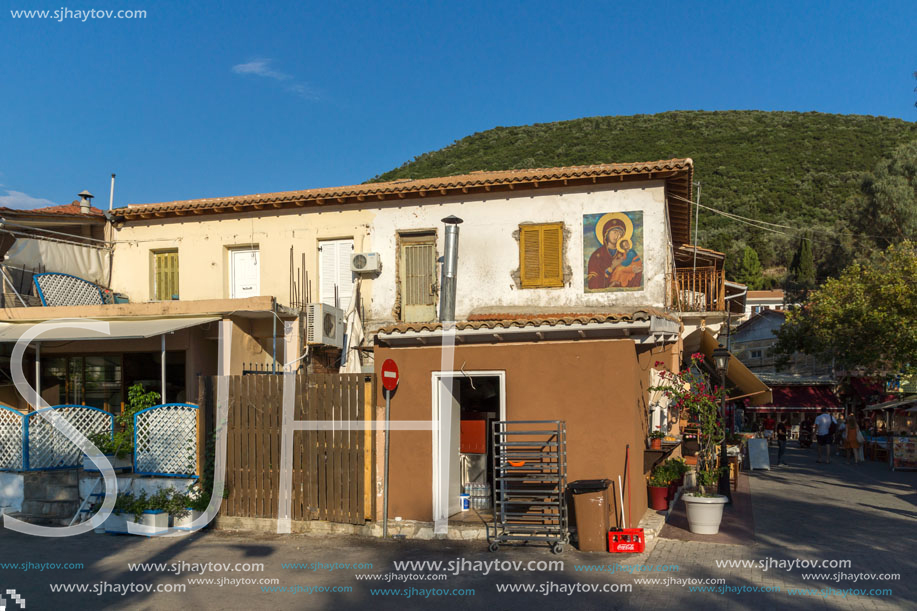 VASILIKI, LEFKADA, GREECE JULY 16, 2014: Coastal street with restaurants in Village of Vasiliki, Lefkada, Ionian Islands, Greece