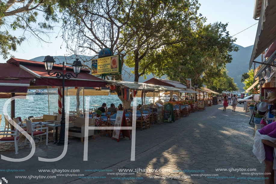 VASILIKI, LEFKADA, GREECE JULY 16, 2014: Coastal street with restaurants in Village of Vasiliki, Lefkada, Ionian Islands, Greece