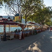 VASILIKI, LEFKADA, GREECE JULY 16, 2014: Coastal street with restaurants in Village of Vasiliki, Lefkada, Ionian Islands, Greece