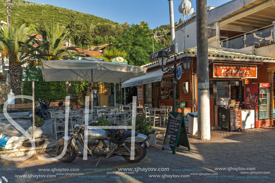 VASILIKI, LEFKADA, GREECE JULY 16, 2014: Coastal street with restaurants in Village of Vasiliki, Lefkada, Ionian Islands, Greece