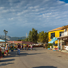 VASILIKI, LEFKADA, GREECE JULY 16, 2014: Coastal street with restaurants in Village of Vasiliki, Lefkada, Ionian Islands, Greece