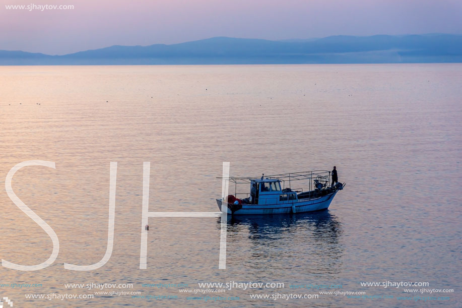 THASSOS, GREECE - APRIL 4, 2016: Sunset view on embankment of Thassos town, East Macedonia and Thrace, Greece