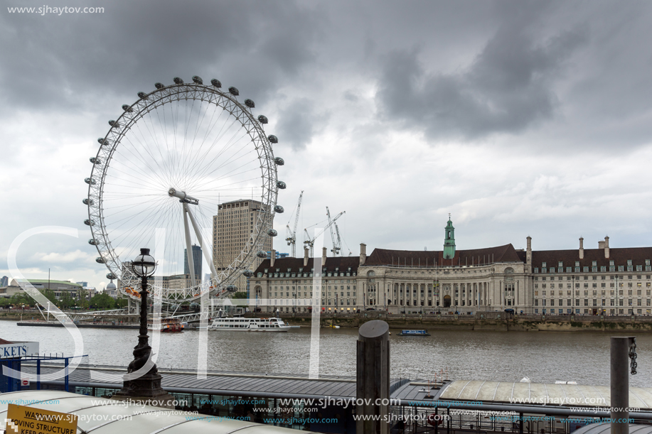 LONDON, ENGLAND - JUNE 16 2016: The London Eye and County Hall from Westminster bridge, London, England, Great Britain