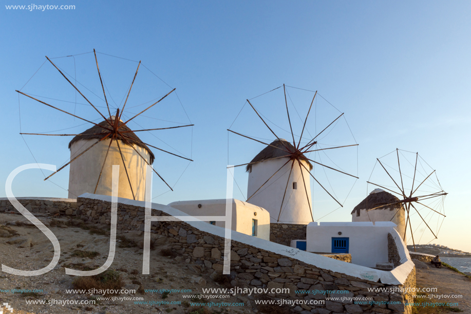 MYKONOS, GREECE - MAY 1, 2013: Amazing sunset and white windmills in Mykonos, Cyclades Islands, Greece