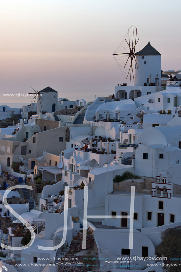 SANTORINI, GREECE - MAY 4, 2013: Amazing Sunset in town of Oia, Santorini island, Thira, Cyclades, Greece