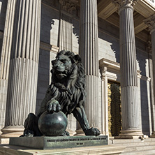 MADRID, SPAIN - JANUARY 22, 2018: Lion sculpture in front of Building of Congress of Deputies (Congreso de los Diputados) in City of Madrid, Spain