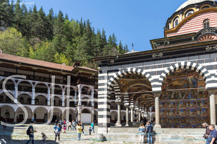 RILA MONASTERY, BULGARIA - APRIL 21, 2018: Tourist visiting Monastery of Saint Ivan (John) of Rila (Rila Monastery), Kyustendil Region, Bulgaria