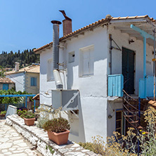 AGIOS NIKITAS, LEFKADA, GREECE - JULY 16, 2014: Traditional houses in village of Agios Nikitas, Lefkada, Ionian Islands, Greece