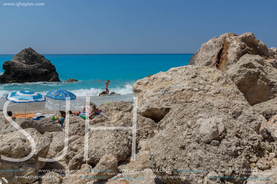 MEGALI PETRA BEACH, LEFKADA, GREECE - JULY 16, 2014: Panoramic view of blue waters of Megali Petra Beach, Lefkada, Ionian Islands, Greece