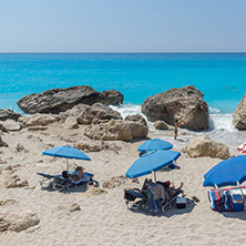 MEGALI PETRA BEACH, LEFKADA, GREECE - JULY 16, 2014: Panoramic view of blue waters of Megali Petra Beach, Lefkada, Ionian Islands, Greece