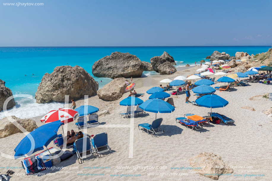 MEGALI PETRA BEACH, LEFKADA, GREECE - JULY 16, 2014: Panoramic view of blue waters of Megali Petra Beach, Lefkada, Ionian Islands, Greece